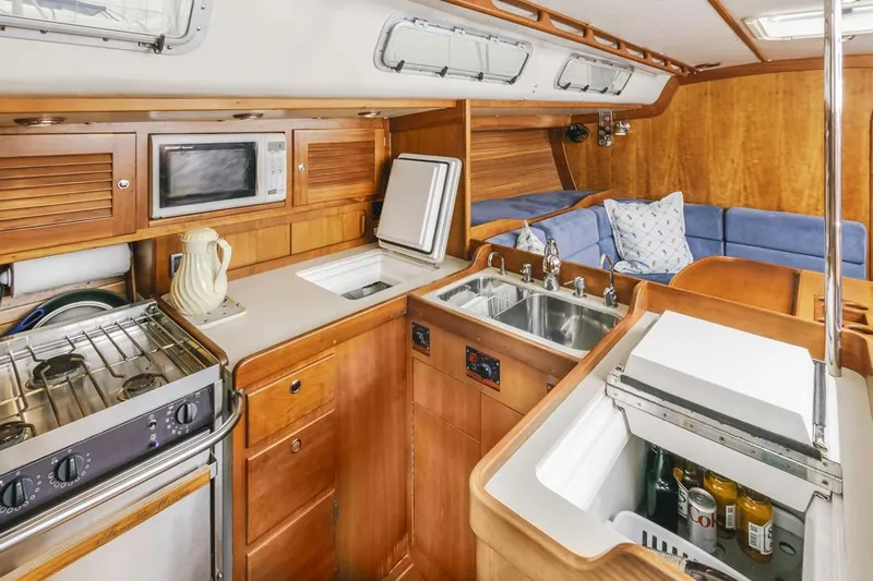 Lark Yacht Photos Pics Interior of 2001 J Boats 46 yacht with kitchen and seating area.