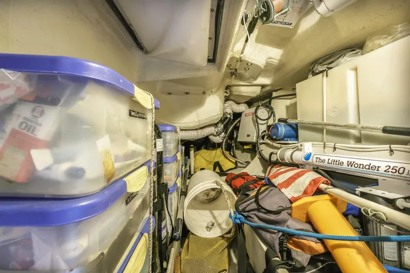 Lark Yacht Photos Pics Storage area in a 2001 J Boats 46, featuring organized containers and equipment.