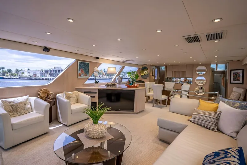 Lady Helen Yacht Photos Pics Luxurious interior of a 1982 Broward 87 yacht with elegant seating and decor.