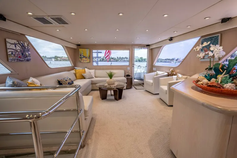 Lady Helen Yacht Photos Pics Luxurious interior of a 1982 Broward 87 yacht with elegant seating and decor.