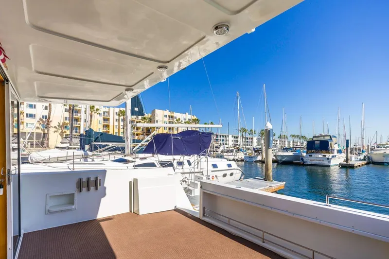 Katerina Yacht Photos Pics 1996 Navigator 5300 Classic yacht docked in a sunny marina with sailboats.