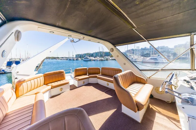 Katerina Yacht Photos Pics Spacious interior of 1996 Navigator 5300 Classic yacht with leather seating and marina view.