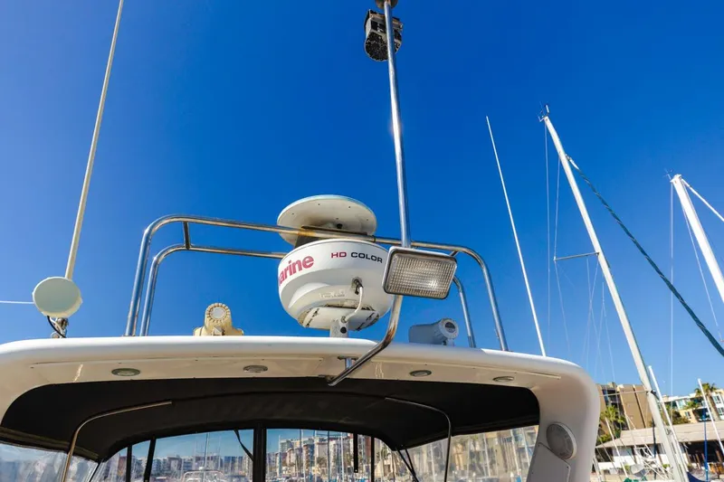 Katerina Yacht Photos Pics Radar equipment on a 1996 Navigator 5300 Classic yacht under clear blue sky.