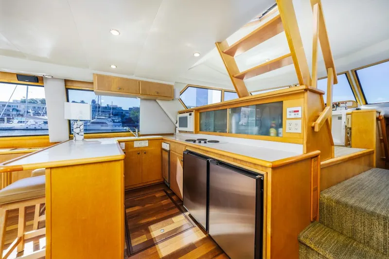 Katerina Yacht Photos Pics Interior of 1996 Navigator 5300 Classic yacht with modern kitchen and wooden finishes.