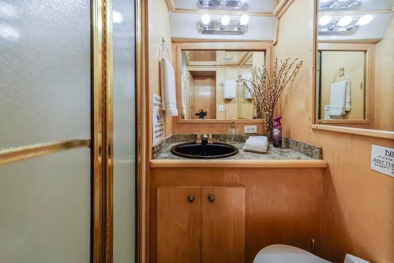 Katerina Yacht Photos Pics Bathroom interior of 1996 Navigator 5300 Classic yacht with elegant fixtures and decor.