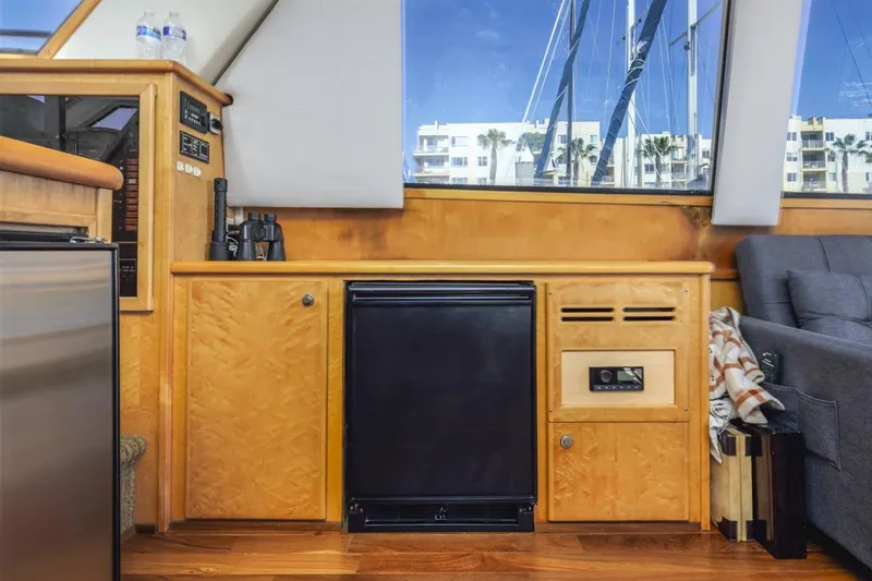 Katerina Yacht Photos Pics Interior of 1996 Navigator 5300 Classic yacht with wooden cabinetry and modern amenities.