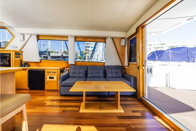 Katerina Yacht Photos Pics Interior of 1996 Navigator 5300 Classic yacht with wooden flooring and modern furnishings.