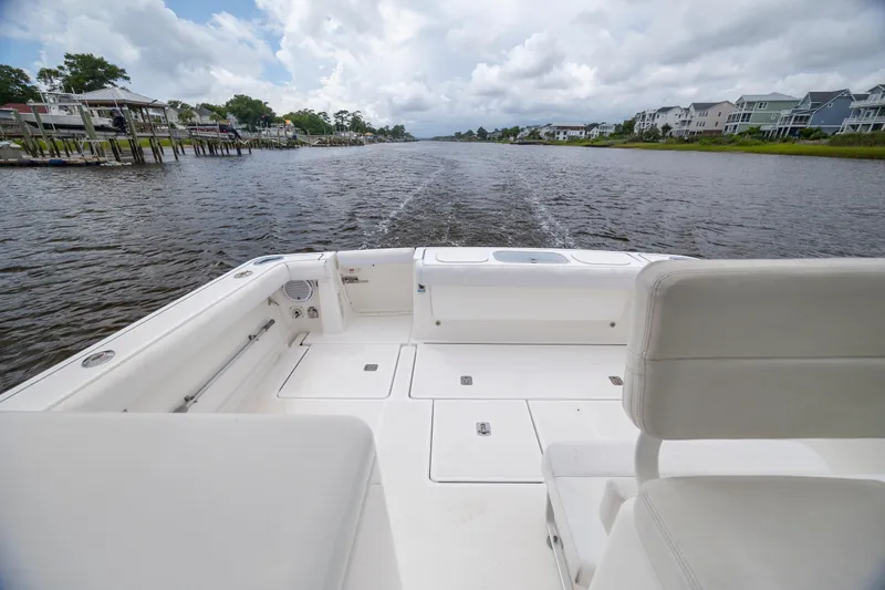 Knot On Call Yacht Photos Pics 2004 Tiara Yachts 3200 Open boat cruising on a scenic river.