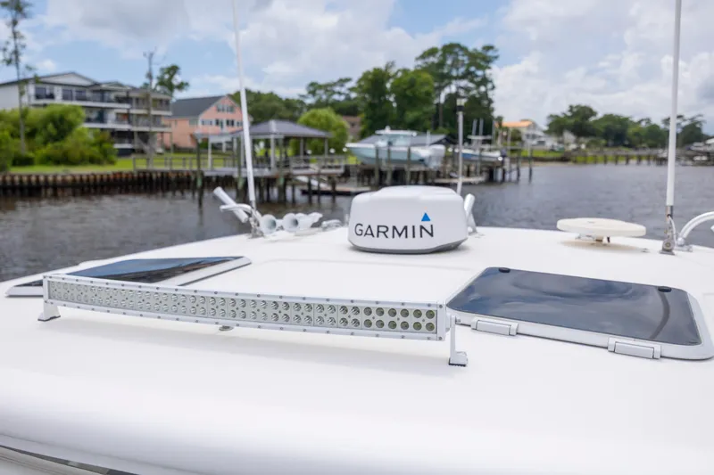 Knot On Call Yacht Photos Pics 2004 Tiara Yachts 3200 Open with Garmin radar, docked near waterfront homes.