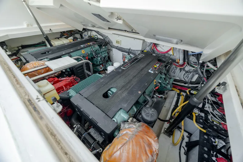 Knot On Call Yacht Photos Pics Engine compartment of 2004 Tiara Yachts 3200 Open, showcasing dual engines and wiring.