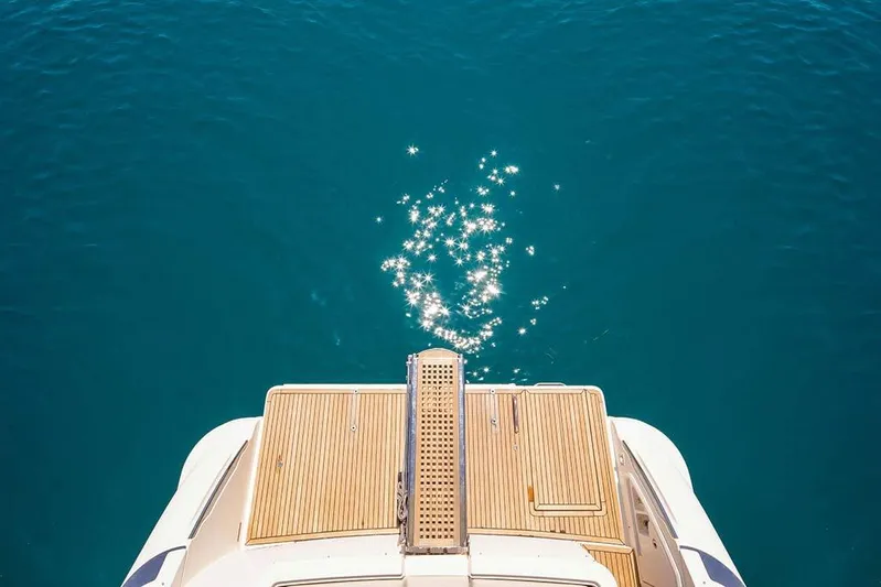  Yacht Photos Pics Rear view of 2008 Azimut 43 yacht with sparkling blue water.