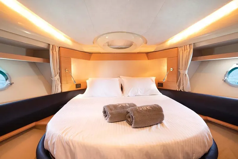  Yacht Photos Pics Luxurious bedroom interior of 2008 Azimut 43 yacht with cozy bedding and ambient lighting.