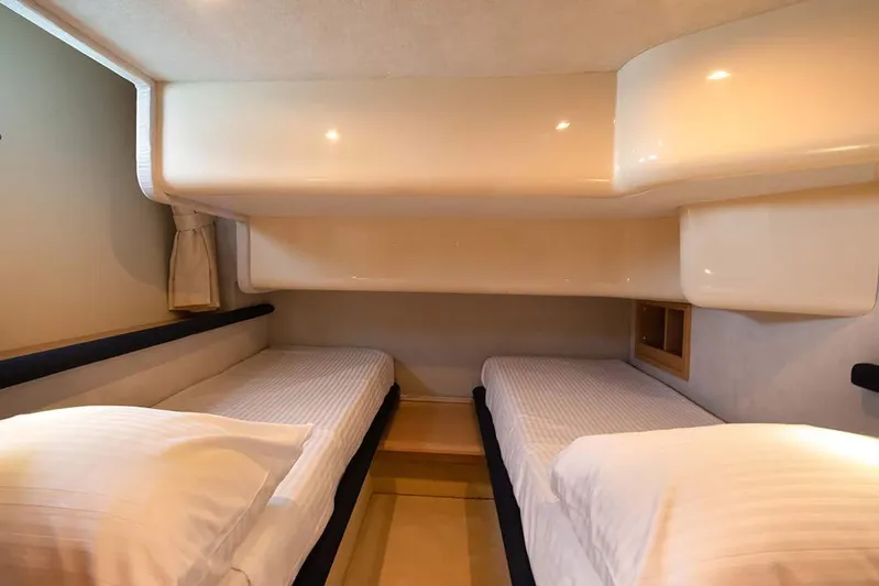  Yacht Photos Pics Twin cabin interior of 2008 Azimut 43 yacht with modern design and cozy bedding.