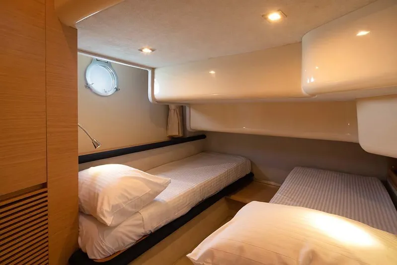  Yacht Photos Pics Interior of 2008 Azimut 43 yacht with twin beds and modern lighting.