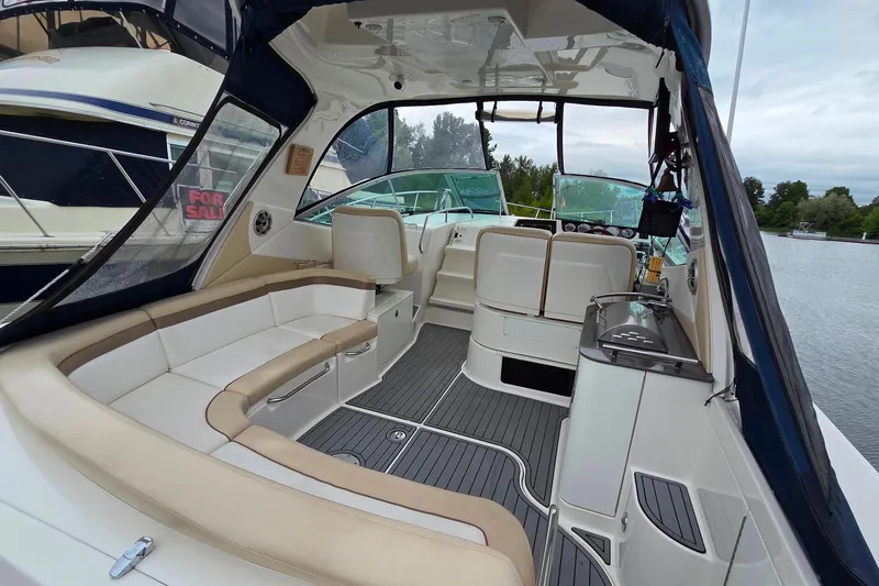  Yacht Photos Pics 2013 Sea Ray 370 Sundancer interior with seating, helm, and water view.