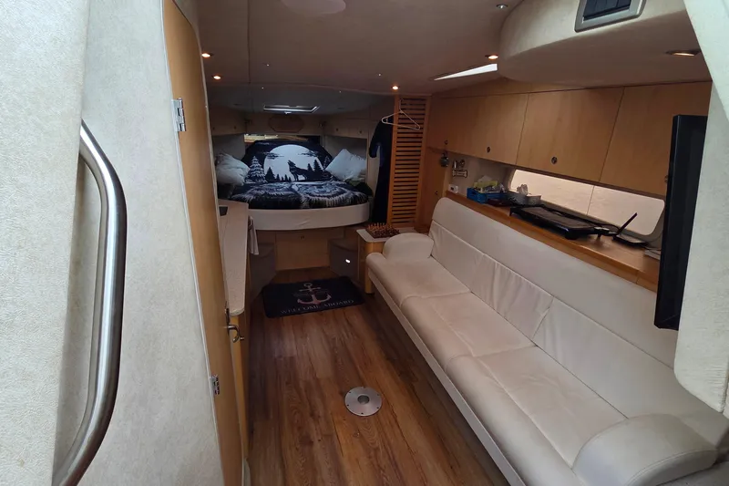  Yacht Photos Pics Luxurious interior of 2013 Sea Ray 370 Sundancer yacht with cozy seating and elegant decor.