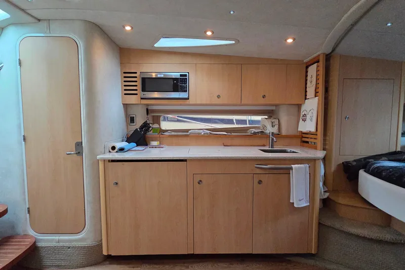  Yacht Photos Pics Interior of 2013 Sea Ray 370 Sundancer yacht with modern kitchen amenities.