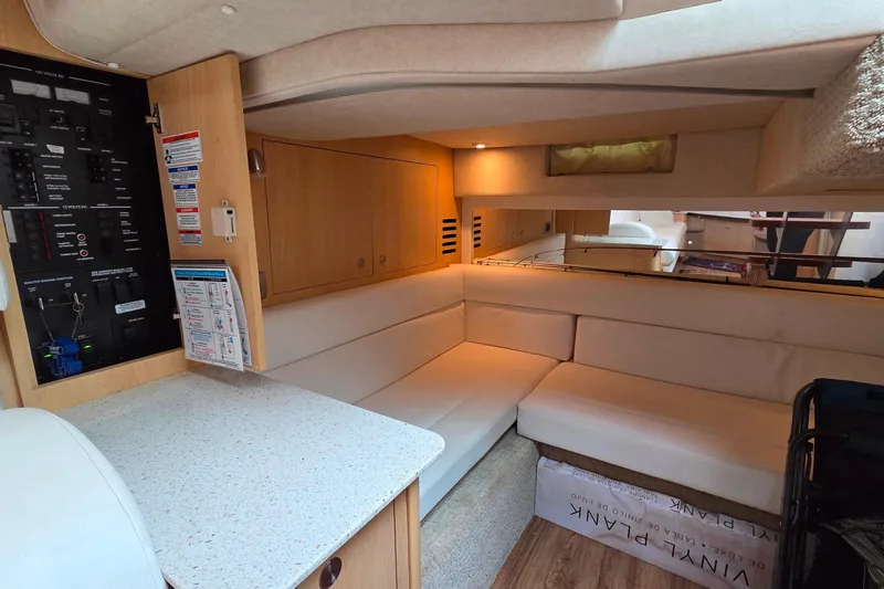  Yacht Photos Pics Luxurious interior of 2013 Sea Ray 370 Sundancer yacht with cozy seating area.