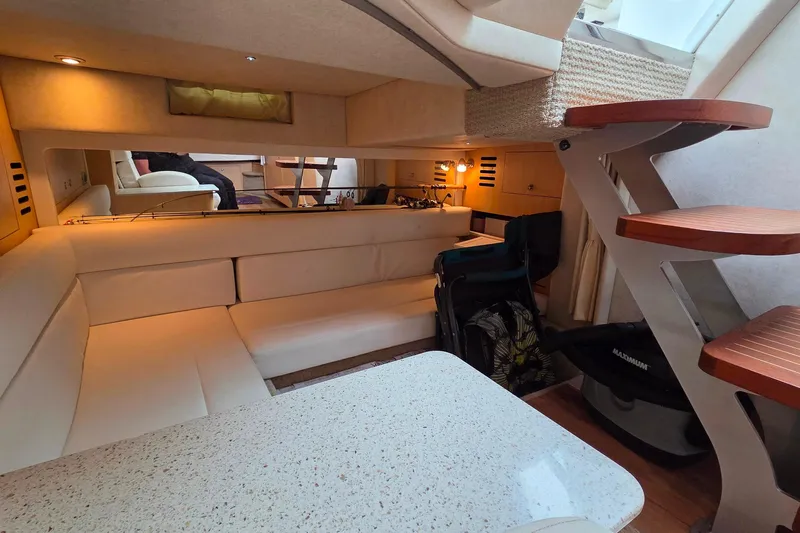  Yacht Photos Pics Luxurious interior of 2013 Sea Ray 370 Sundancer yacht with cozy seating and modern design.