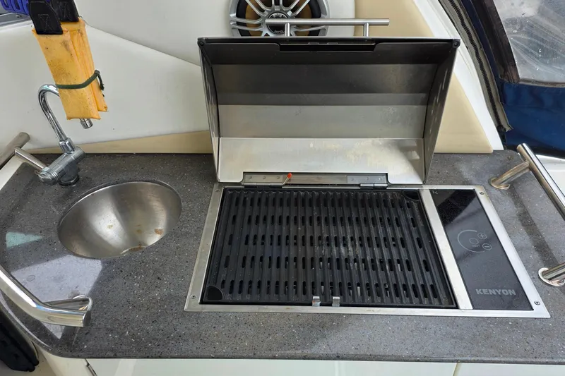  Yacht Photos Pics Outdoor kitchen on 2013 Sea Ray 370 Sundancer with sink and Kenyon grill.