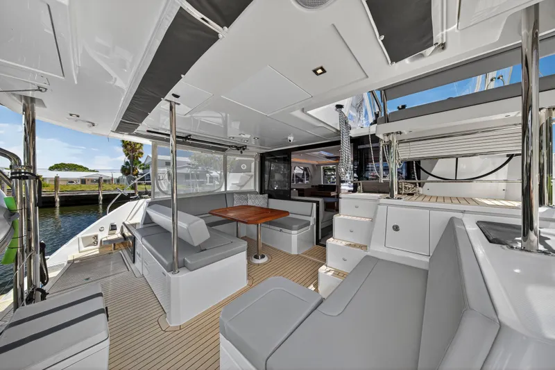 Ten-seven Freedom Yacht Photos Pics Luxurious 2023 Leopard 42 yacht interior with modern seating and dining area.