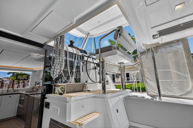 Ten-seven Freedom Yacht Photos Pics Modern interior of 2023 Leopard 42 yacht with open deck and sleek design.