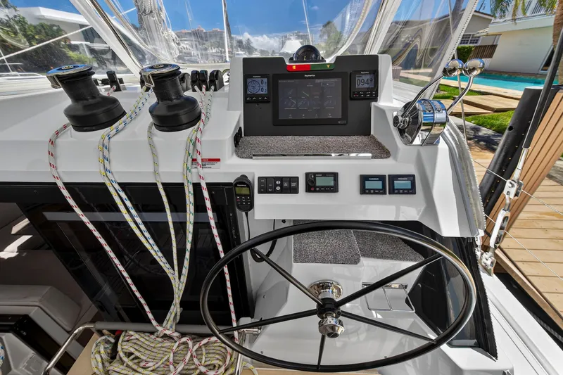 Ten-seven Freedom Yacht Photos Pics Helm of 2023 Leopard 42 yacht with navigation controls and steering wheel.