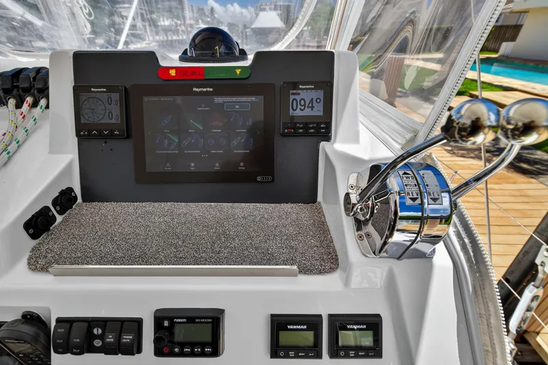 Ten-seven Freedom Yacht Photos Pics Control panel of a 2023 Leopard 42 yacht with navigation and throttle controls.