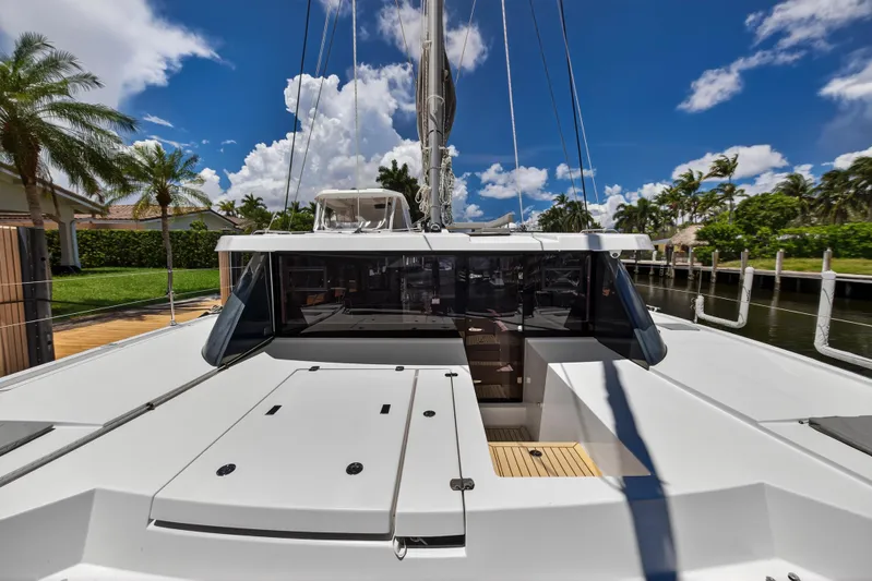 Ten-seven Freedom Yacht Photos Pics 2023 Leopard 42 catamaran docked, showcasing sleek design under a vibrant blue sky.