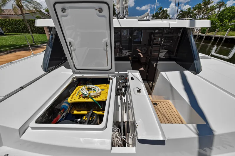 Ten-seven Freedom Yacht Photos Pics Open storage compartment on 2023 Leopard 42 catamaran, showcasing equipment and tools.