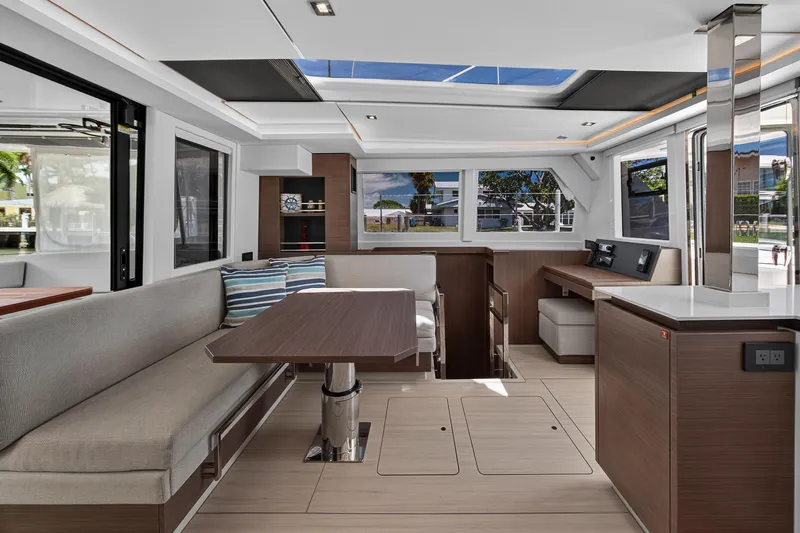 Ten-seven Freedom Yacht Photos Pics Modern interior of 2023 Leopard 42 yacht with sleek design and spacious seating area.