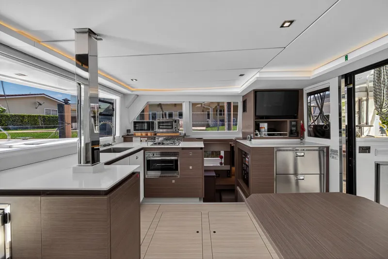 Ten-seven Freedom Yacht Photos Pics Modern kitchen interior of 2023 Leopard 42 yacht with sleek design and appliances.
