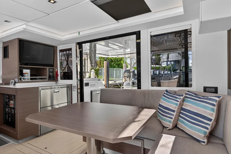 Ten-seven Freedom Yacht Photos Pics Luxurious interior of 2023 Leopard 42 yacht with modern seating and entertainment area.