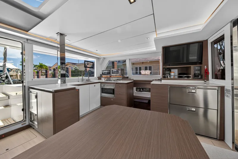 Ten-seven Freedom Yacht Photos Pics Luxurious interior of 2023 Leopard 42 yacht with modern kitchen and sleek design.