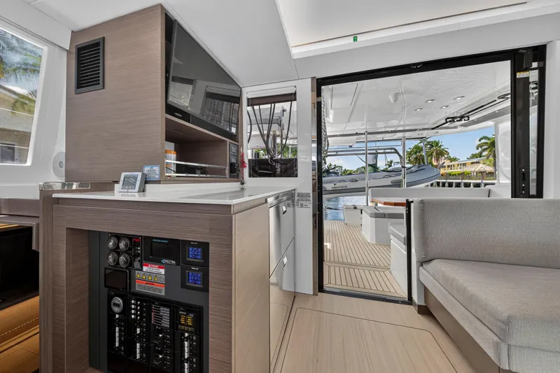 Ten-seven Freedom Yacht Photos Pics Interior of 2023 Leopard 42 yacht, featuring modern kitchen and open deck view.