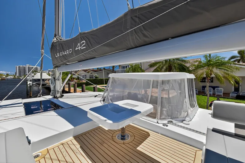 Ten-seven Freedom Yacht Photos Pics 2023 Leopard 42 catamaran deck with modern design and waterfront view.