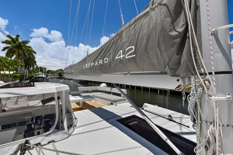 Ten-seven Freedom Yacht Photos Pics 2023 Leopard 42 catamaran docked, featuring sleek design and modern sail rigging.