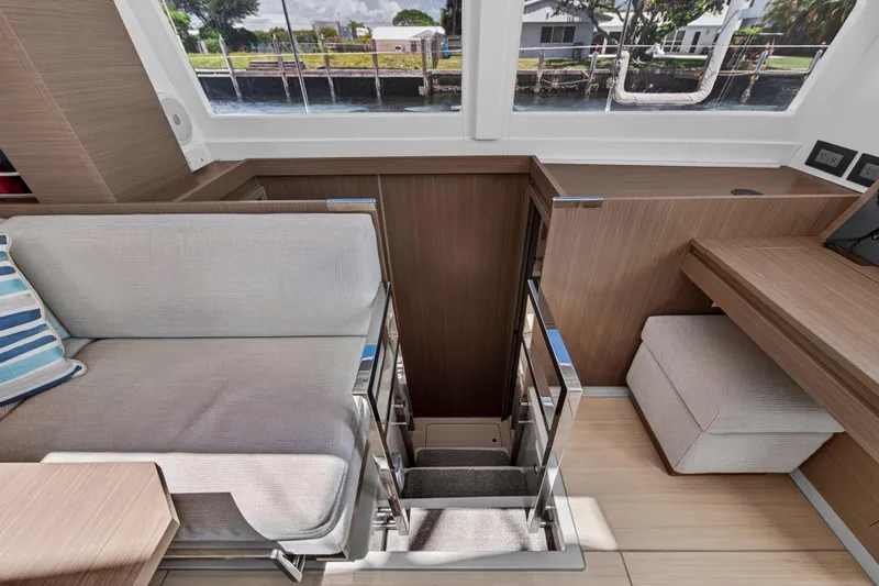 Ten-seven Freedom Yacht Photos Pics Interior of 2023 Leopard 42 yacht with modern seating and staircase.