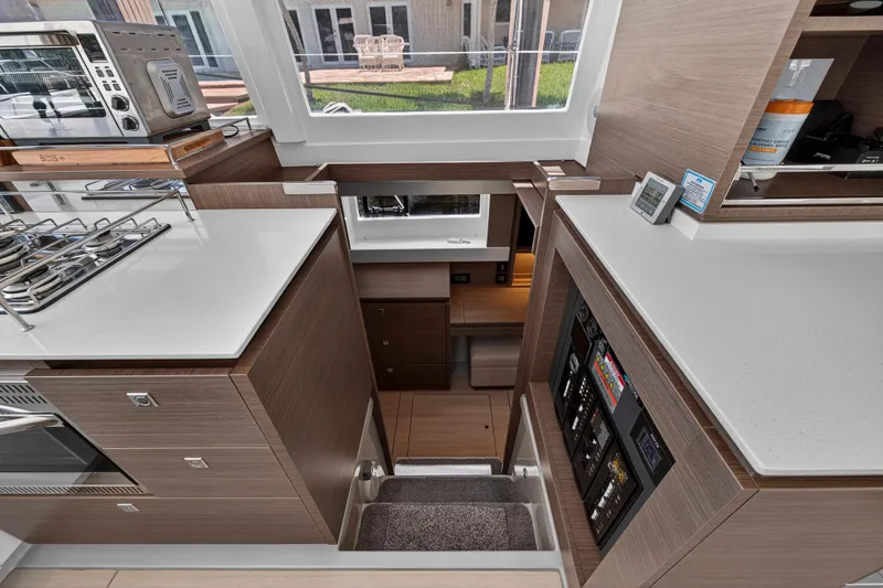 Ten-seven Freedom Yacht Photos Pics Modern kitchen interior of 2023 Leopard 42 yacht with sleek cabinetry and appliances.