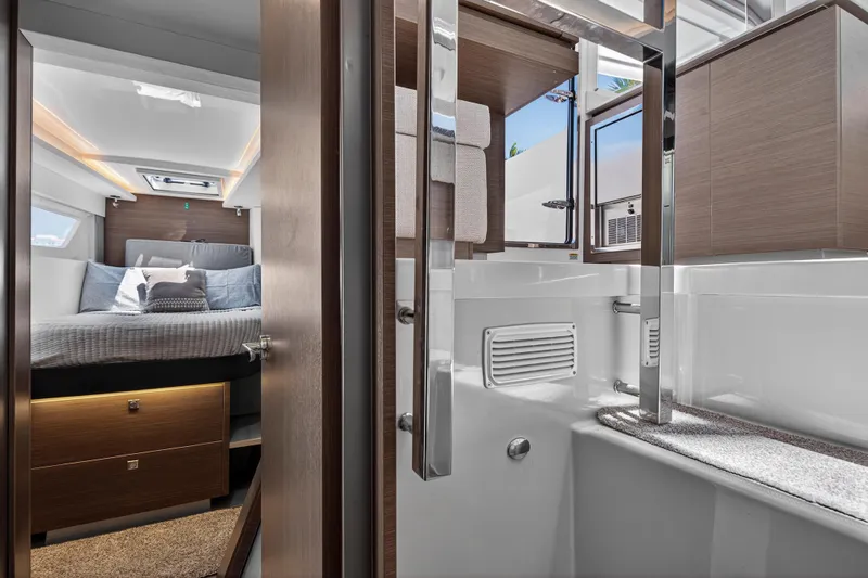 Ten-seven Freedom Yacht Photos Pics Luxurious interior of 2023 Leopard 42 yacht featuring bedroom and bathroom.