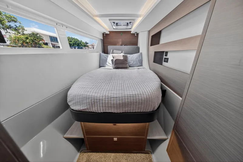 Ten-seven Freedom Yacht Photos Pics Luxurious cabin interior of 2023 Leopard 42 yacht with modern bedding and sleek design.