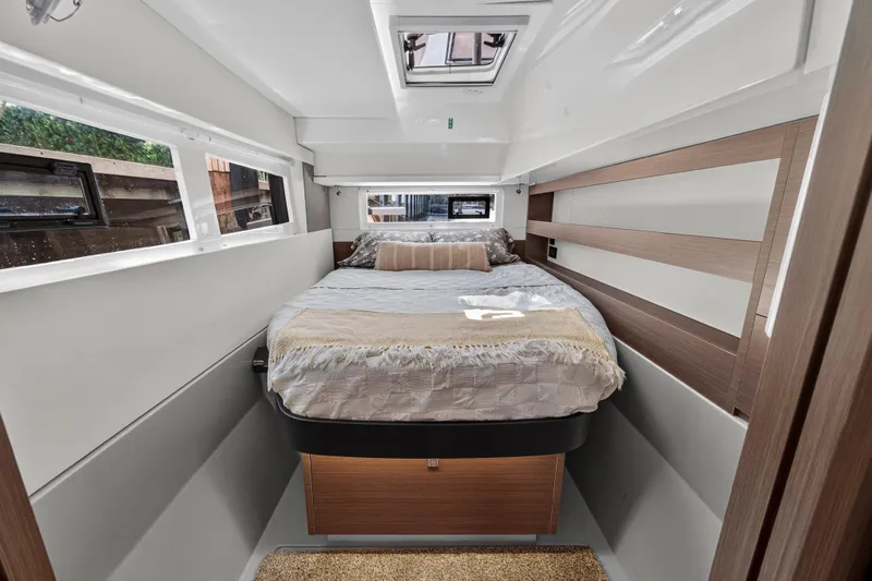 Ten-seven Freedom Yacht Photos Pics Luxurious bedroom interior of 2023 Leopard 42 yacht with modern design and natural light.
