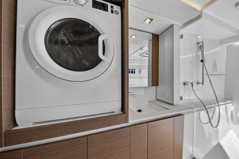 Ten-seven Freedom Yacht Photos Pics Modern laundry and bathroom area on a 2023 Leopard 42 yacht.