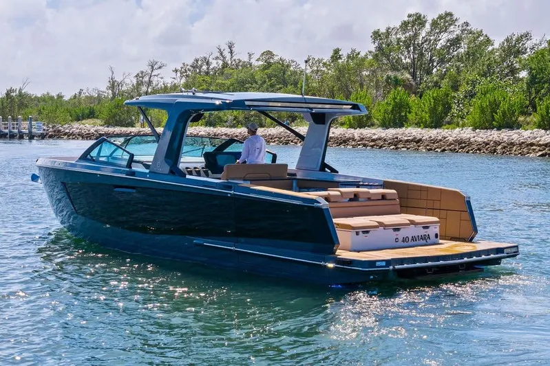  Yacht Photos Pics 2022 Aviara AV40 OB luxury boat cruising on a sunny day.