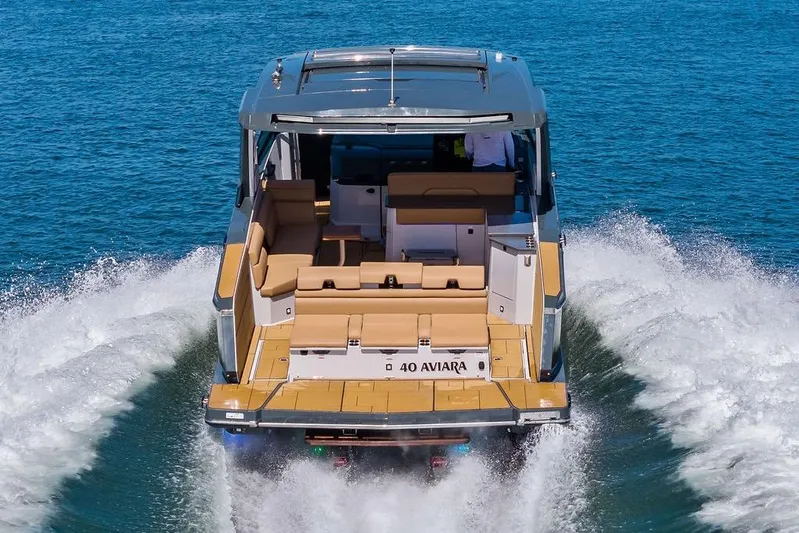  Yacht Photos Pics 2022 Aviara AV40 OB luxury boat cruising on open water.