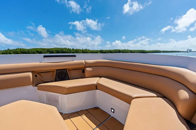  Yacht Photos Pics Luxurious seating on 2022 Aviara AV40 OB boat under clear blue sky.