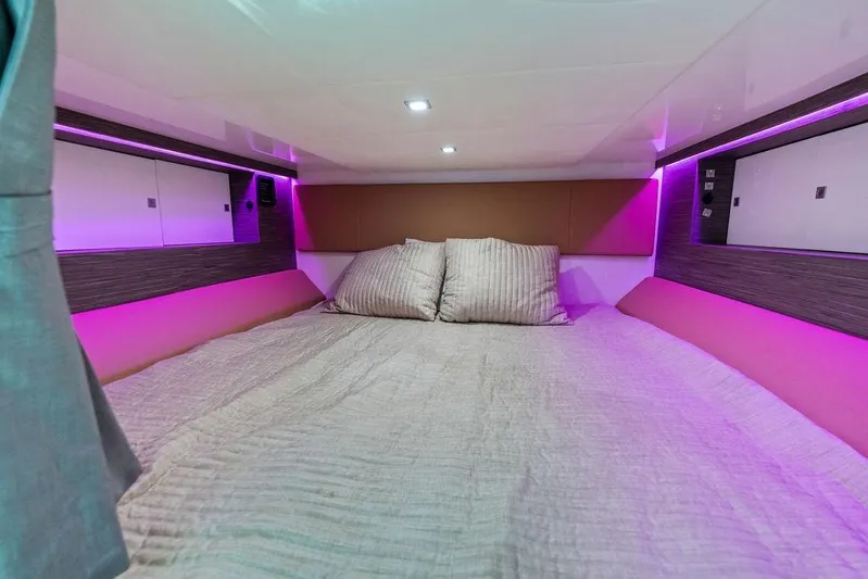  Yacht Photos Pics Luxurious cabin interior of 2022 Aviara AV40 OB with ambient purple lighting.