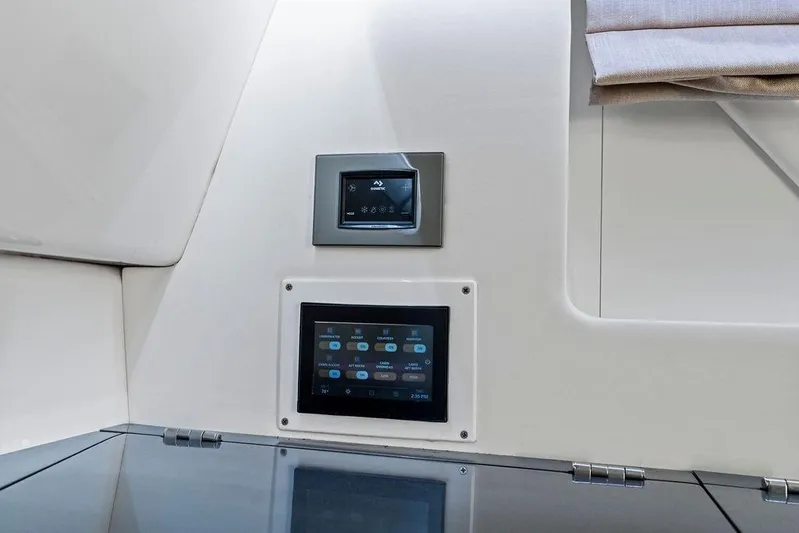  Yacht Photos Pics 2022 Aviara AV40 OB interior control panels with modern touchscreen displays.
