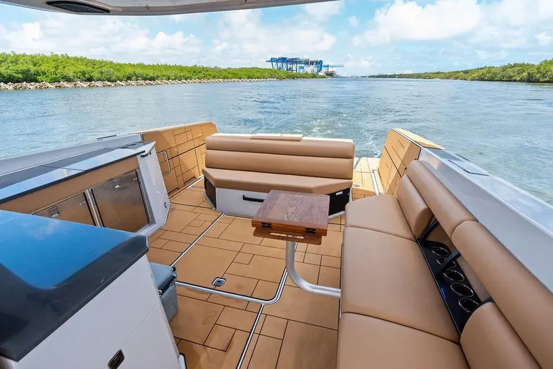  Yacht Photos Pics Luxurious 2022 Aviara AV40 OB boat interior with tan seating and scenic water view.