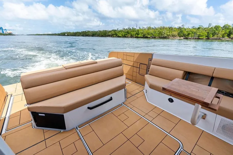  Yacht Photos Pics Luxurious 2022 Aviara AV40 OB boat interior with tan seating and scenic water view.